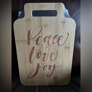 Wooden peace love joy charcuterie board